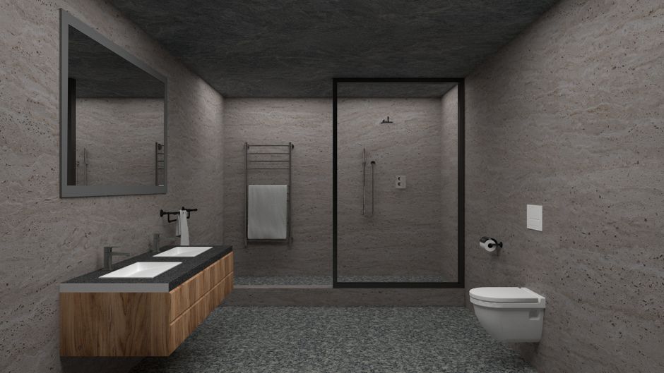 Tradesman completing a design to completion bathroom renovation, showing tiled walls and fitted sanitaryware