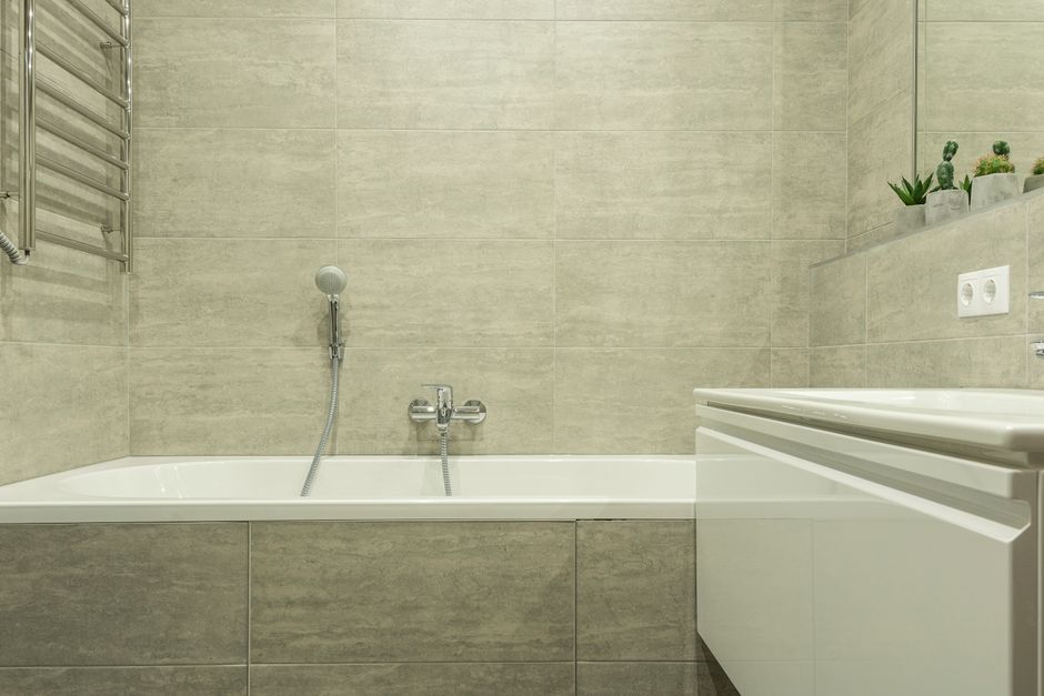 Completed full bathroom renovation in a Liverpool Victorian terrace, featuring a walk-in shower and full-height wall tiles